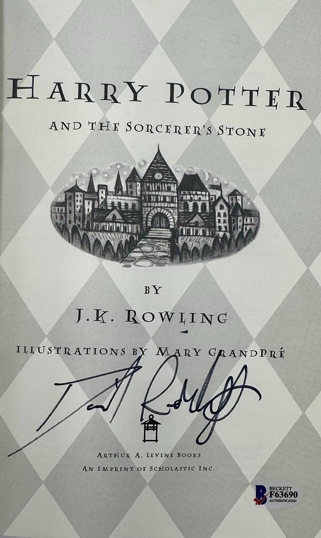 Daniel Radcliffe Autographed Book Sorcerer's Stone  - Beckett COA