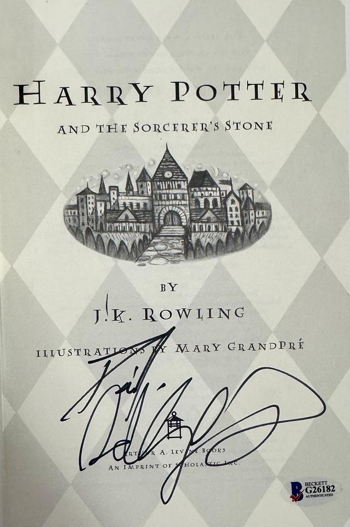 Daniel Radcliffe Autographed Book Sorcerer's Stone  - Beckett COA